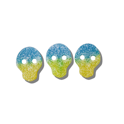 Blue and yellow skulls from LAK & Co Chocolates & Confections, colorful confectionery treats with detailed skull designs.